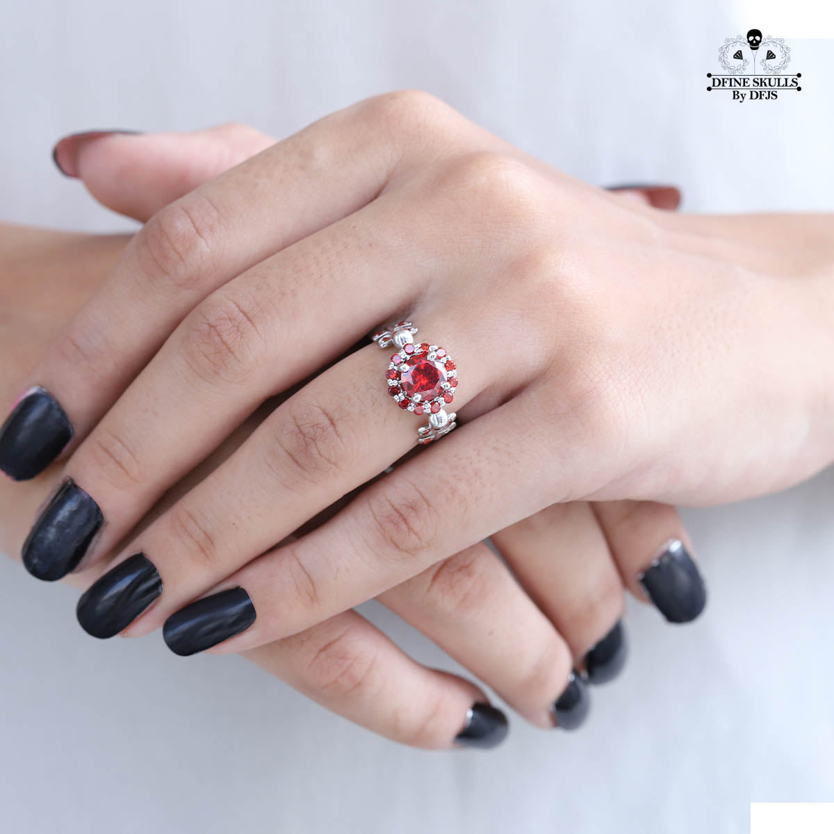 HALO GARNET SKULL PROMISE RING