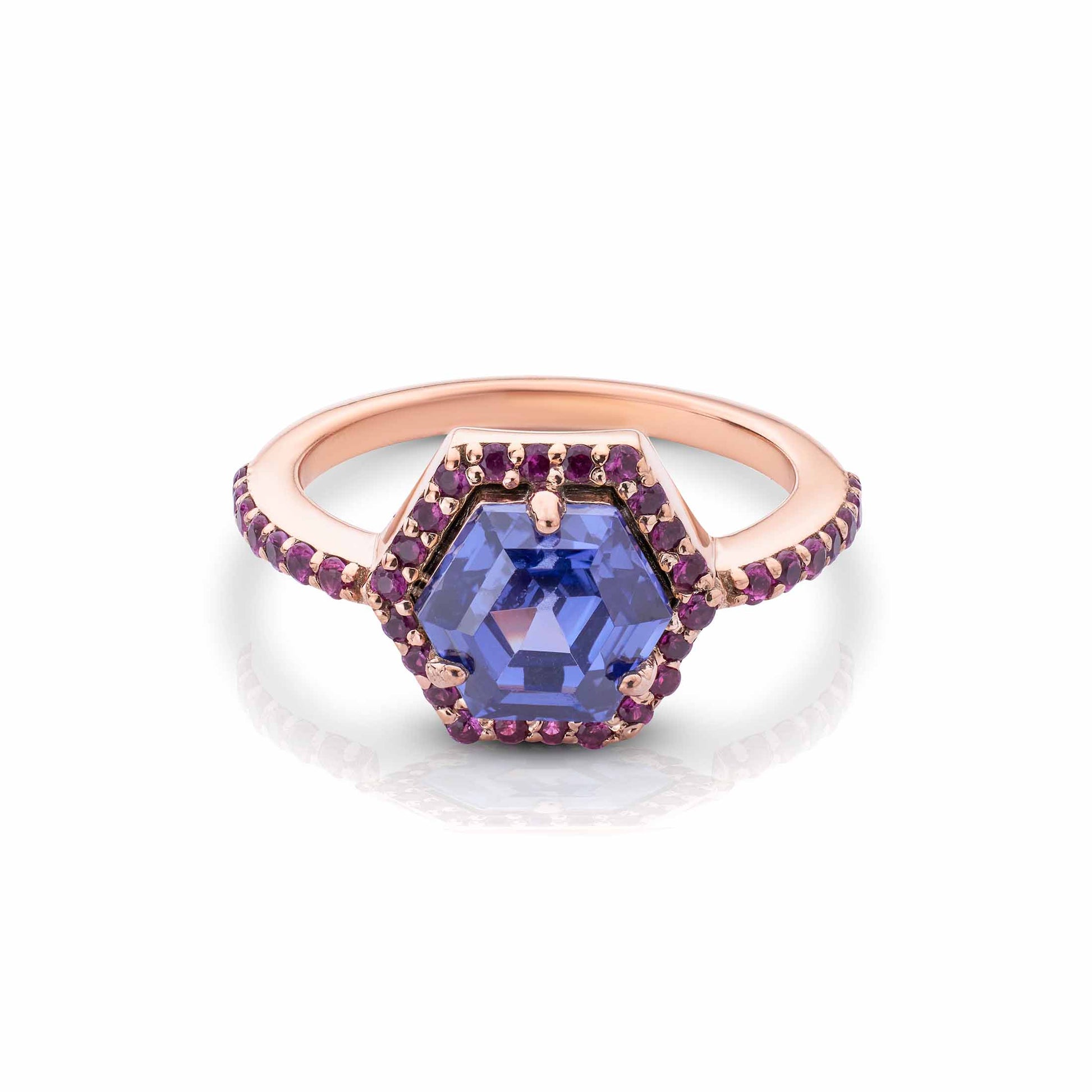 Rose gold hexagon ring with a violet center stone and purple gemstone halo on a pave-set band.