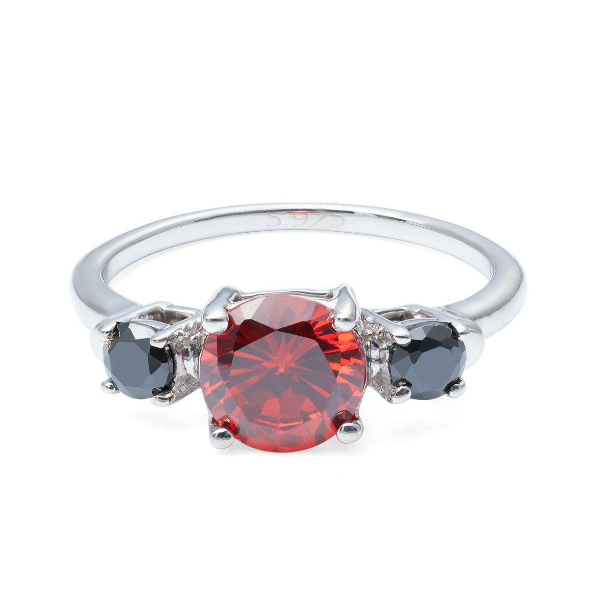 Round red gemstone ring with black stone accents and S925 hallmark visible on the silver band.