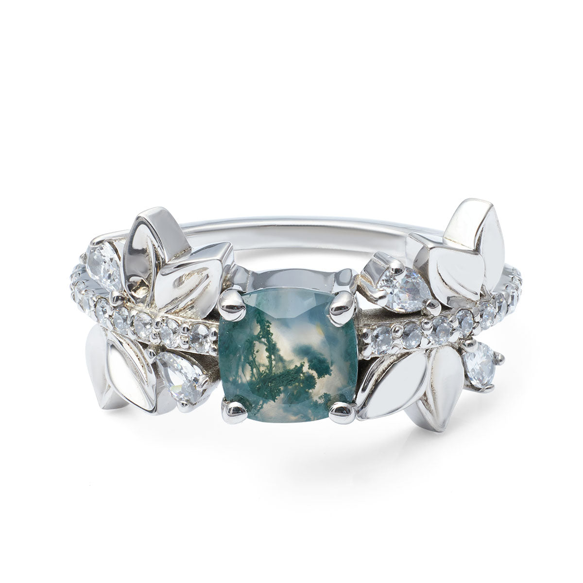 moss agate center stone framed by silver leaves and small diamonds.