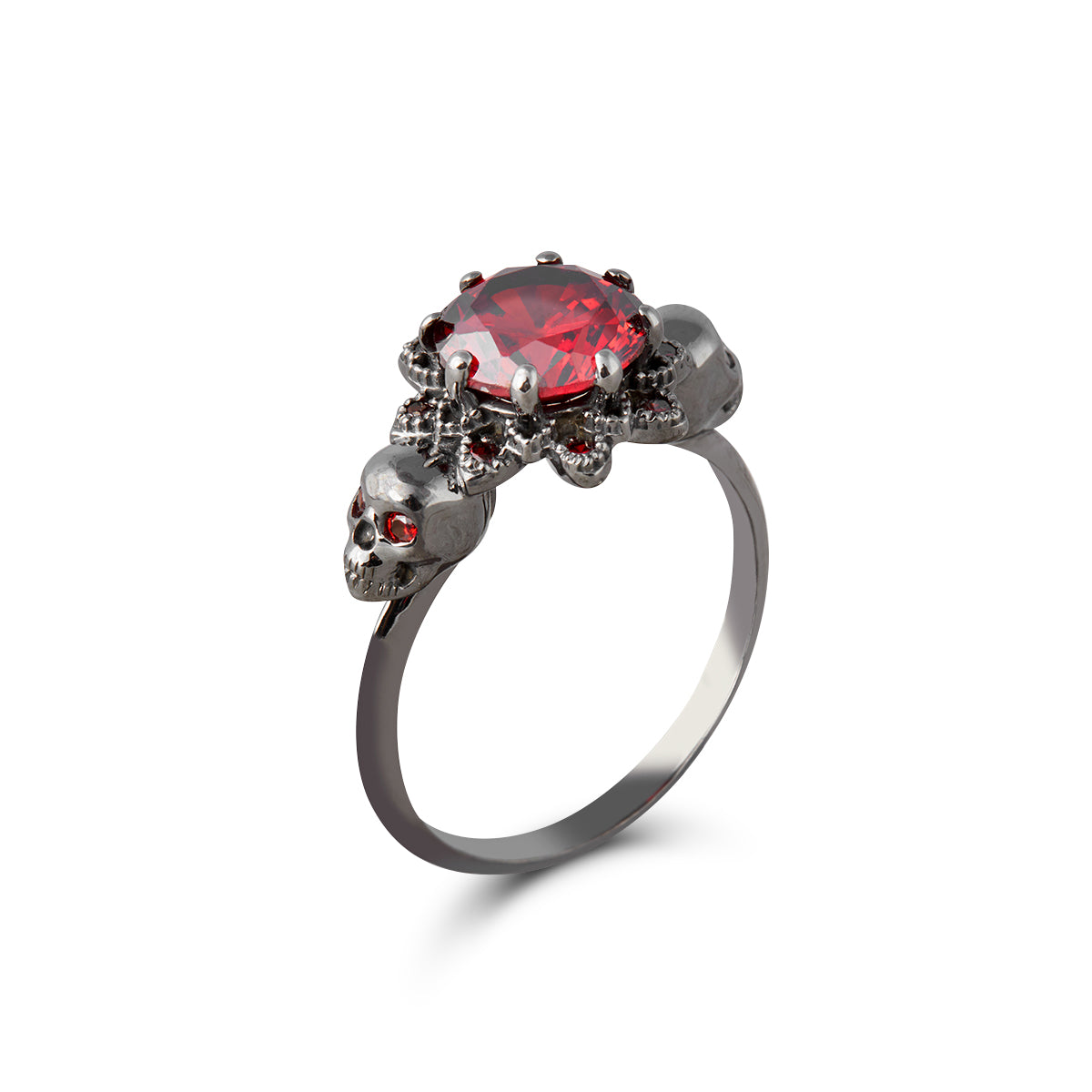 black skull ring with red garnet gemstones set in gun metal finished sterling silver