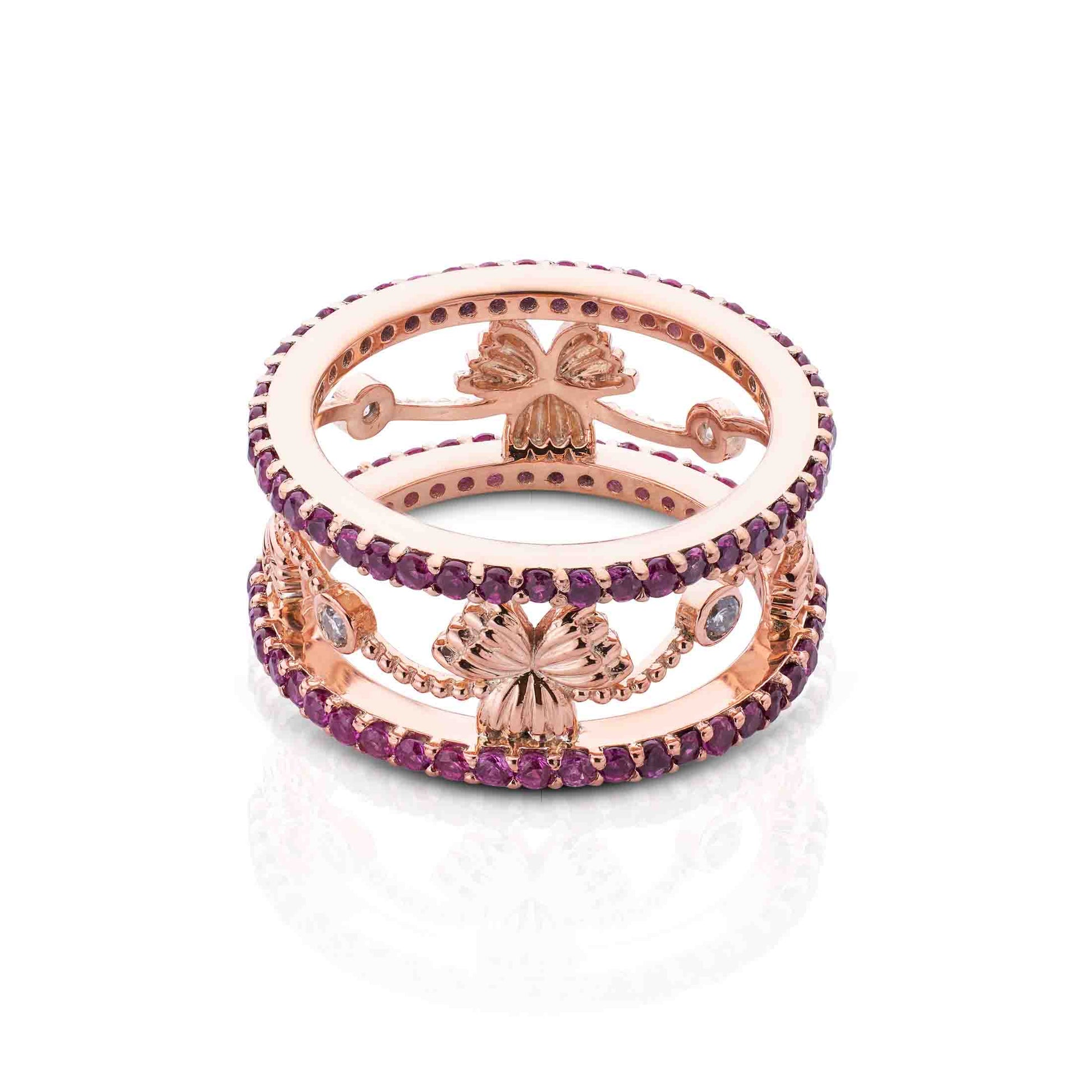 Wide rose gold band with parallel purple stone tracks connected by floral motifs and clear accents.