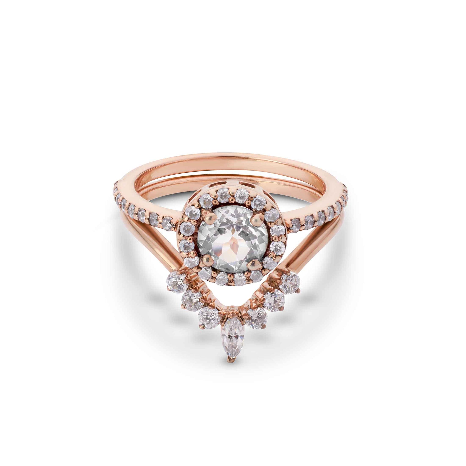 Wedding set a classic halo solitaire layered with a sharp, geometric diamond band.