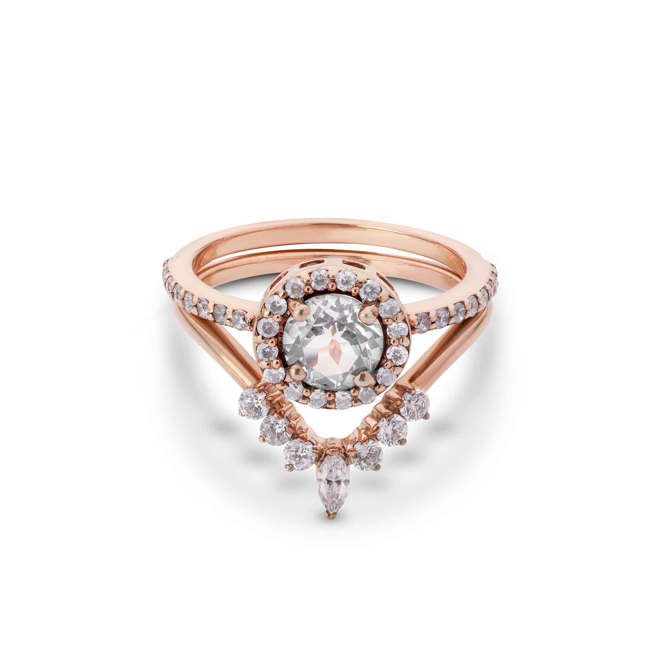 Wedding set a classic halo solitaire layered with a sharp, geometric diamond band.