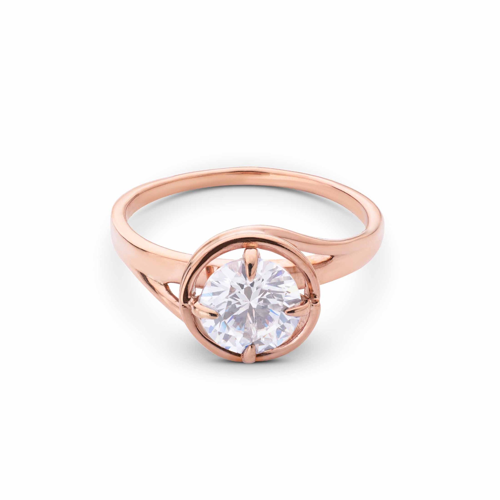 Elegant rose gold engagement ring with a round center stone and a modern, split bypass shank.