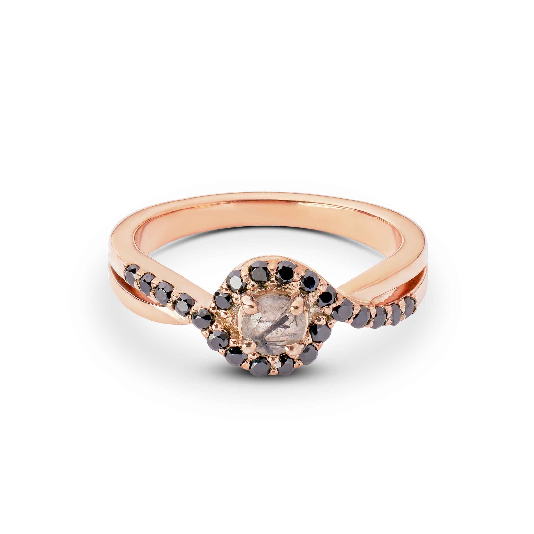 Promise ring with a central diamond and smaller stones on a white background