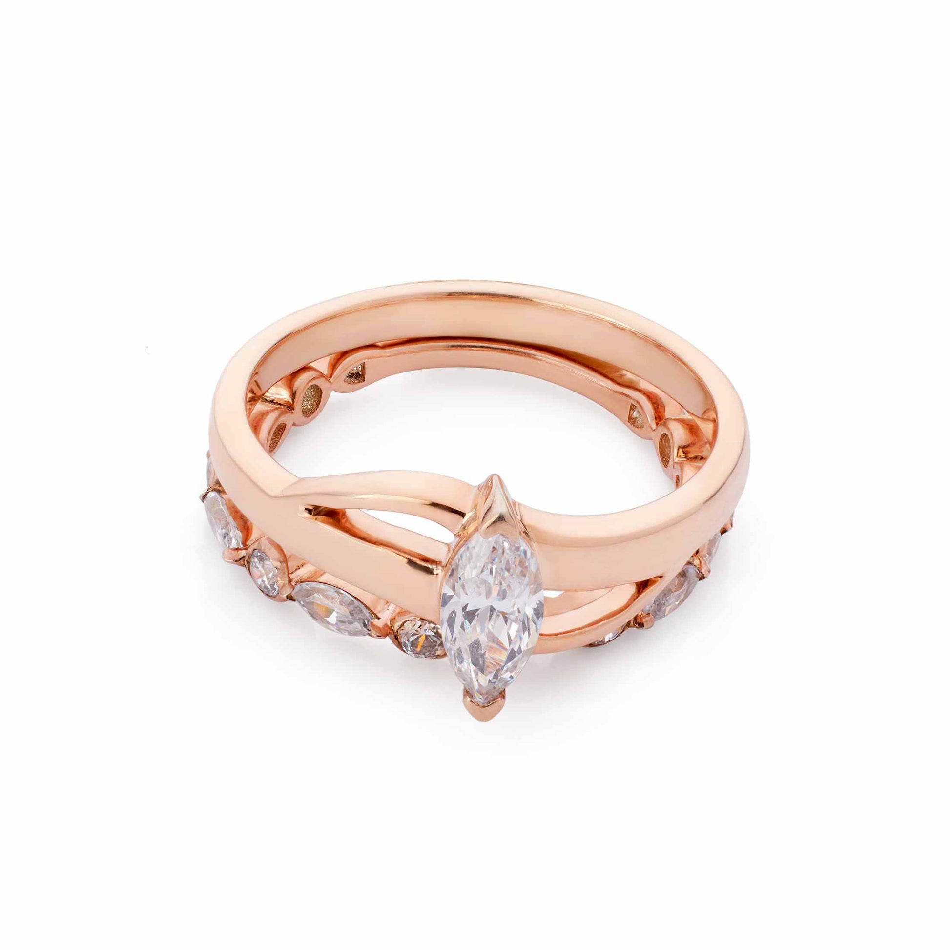 Stacked rose gold jewelry featuring a vertical marquise solitaire and a secondary diamond-set band.