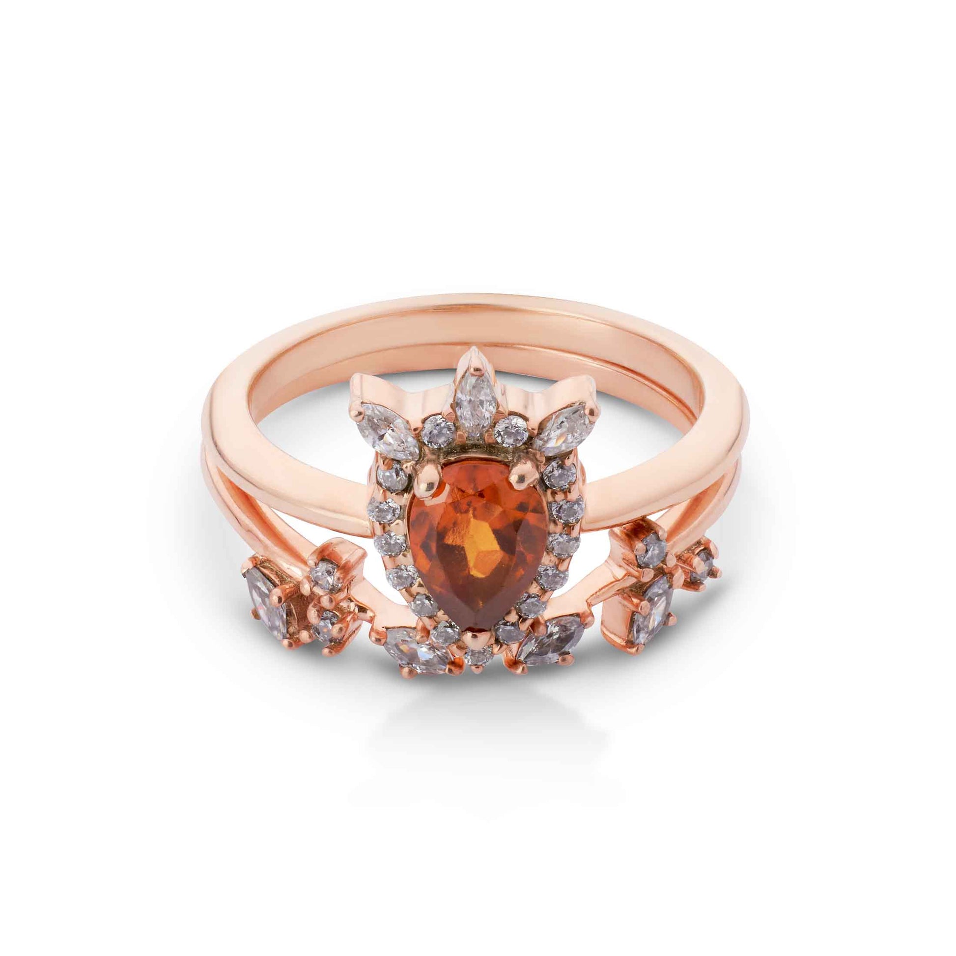 Rose gold ring with a large orange gemstone and smaller diamonds on a white background