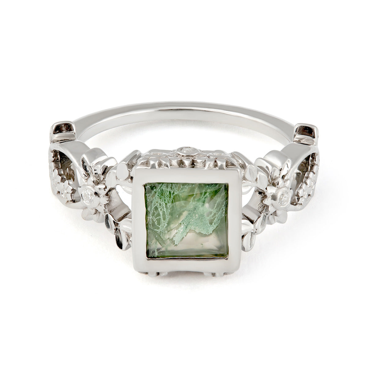 An elegant silver ring featuring a square-cut green moss agate stone, accented by intricate floral metalwork.