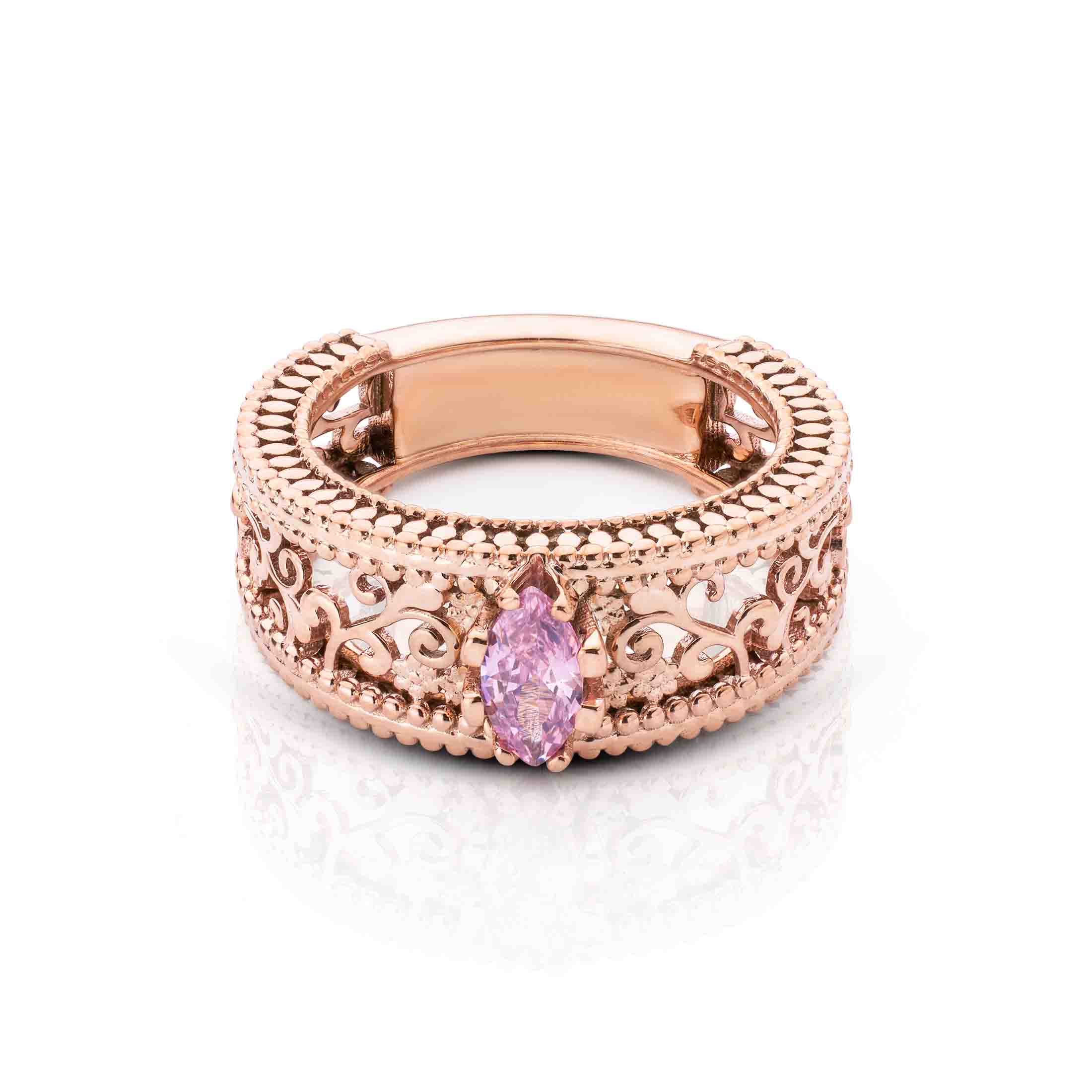 Wide filigree rose gold band showcasing a delicate pink marquise gemstone in a bezel setting.
