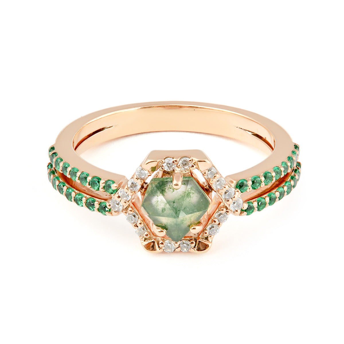  Wedding ring with green gemstone and emerald accents on a white background.
