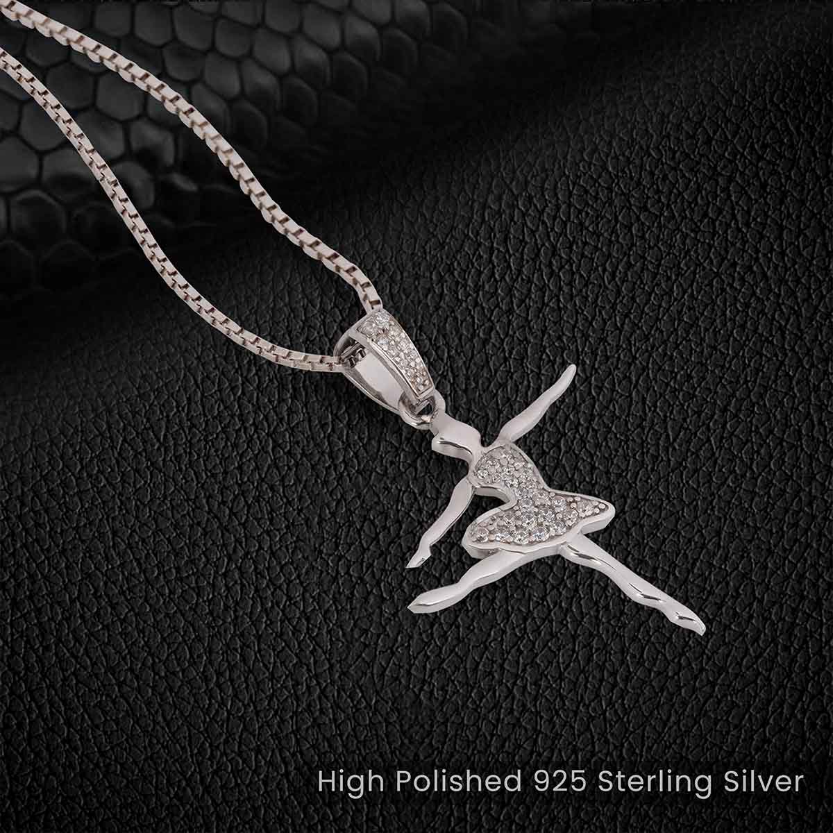 Sterling Silver ballerina pendant Ballet Dancer necklace with chain against a black textured background