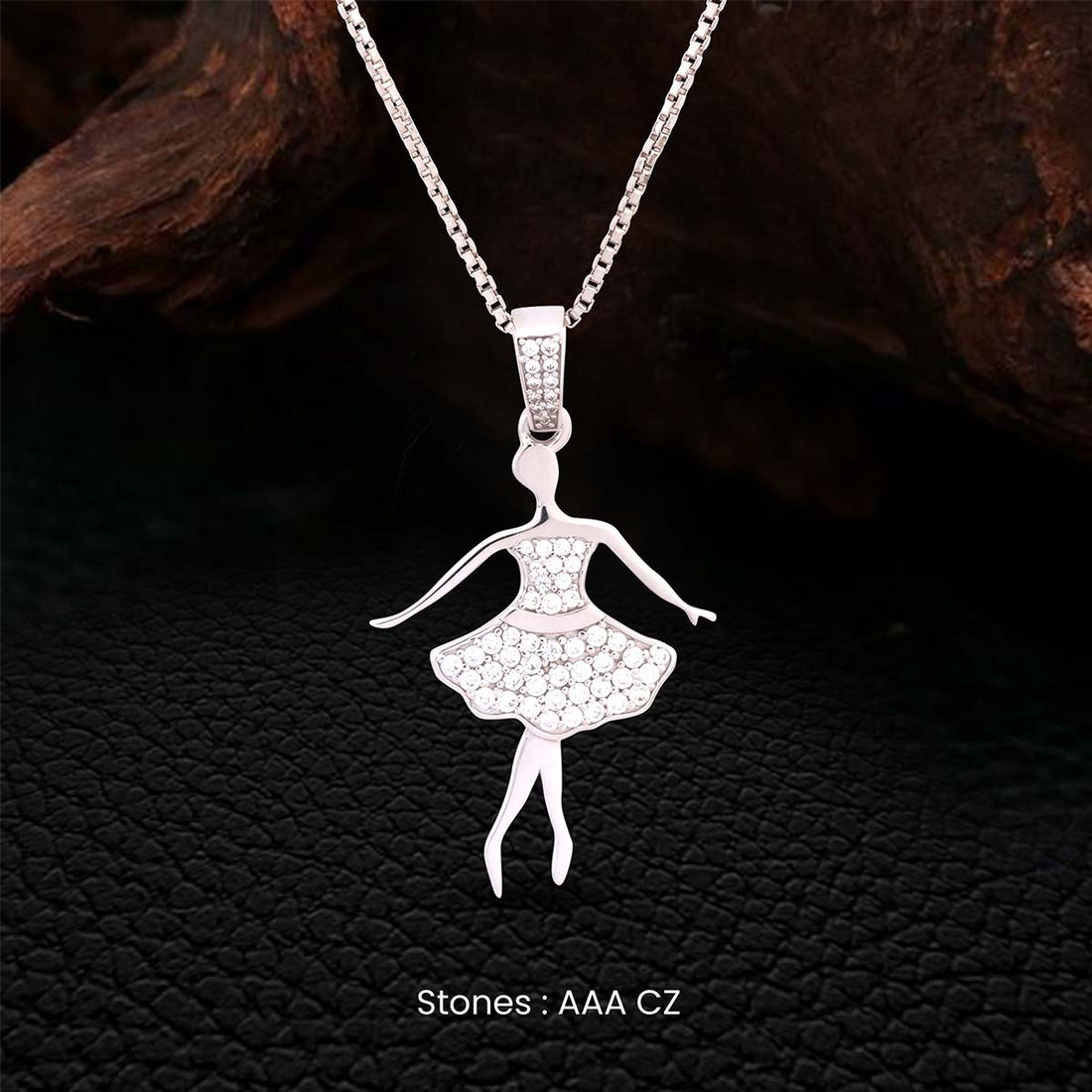 Sterling Silver pendant of a ballerina with AAA CZ stones on a dark textured background