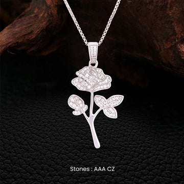 Rose flower pendant necklace in Sterling silver on a dark textured background