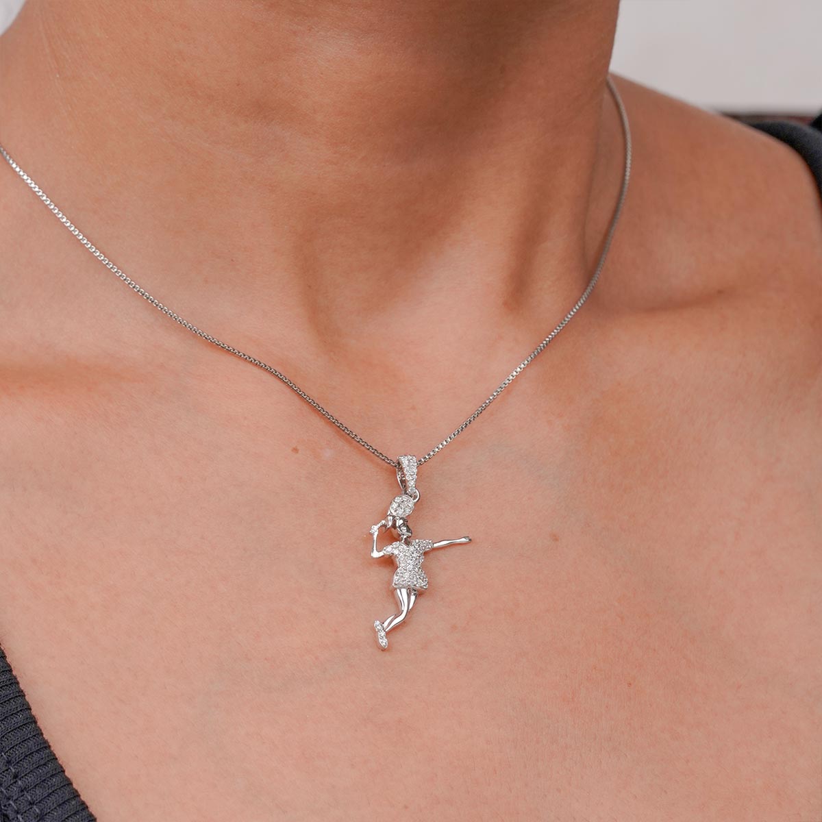 sterling Silver necklace with badminton player pendant on a person's neck