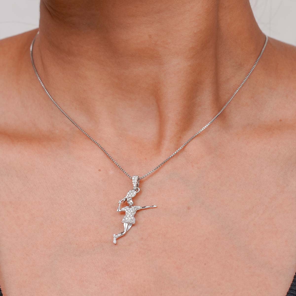 badminton pendant necklace on a person's neck.