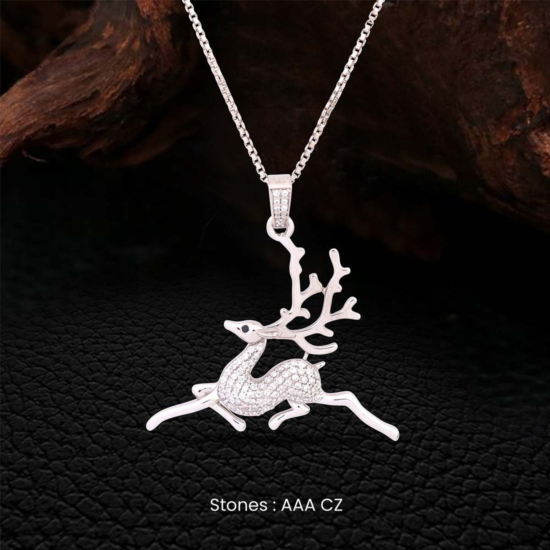 Reindeer Sterling silver pendant necklace on a dark textured background