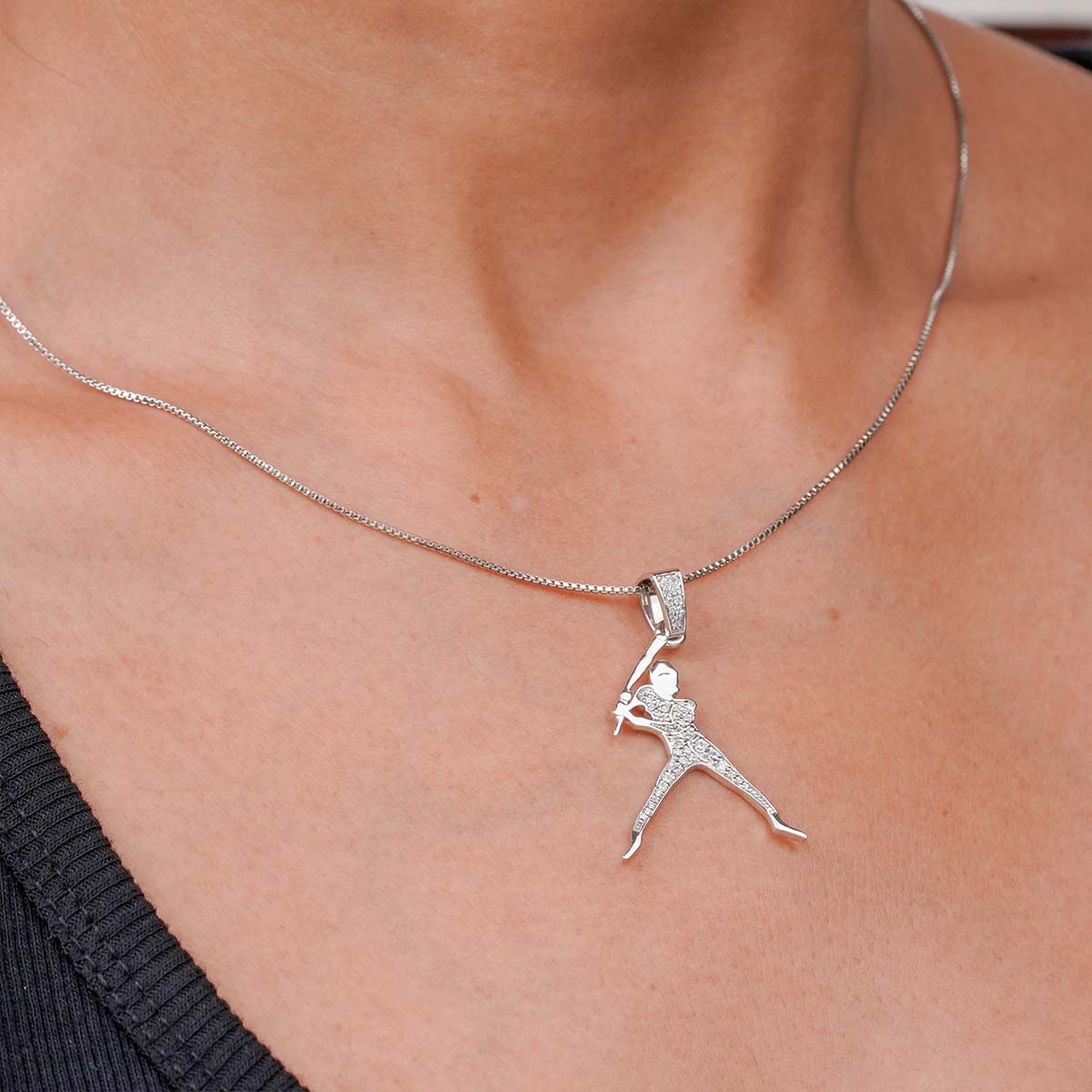 Sterling Silver necklace with a slugger pendant on a person's neck