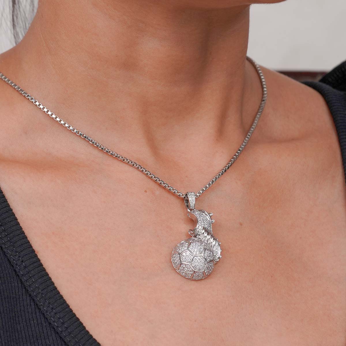 Silver Soccer Ball Shoe Cleat Pendant Necklace worn by a person