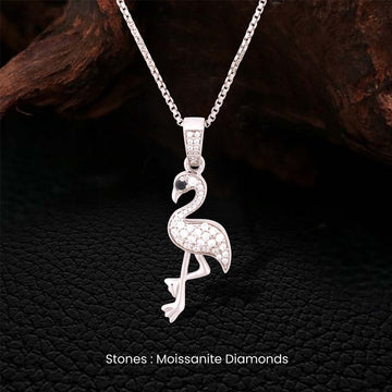 Sterling Silver flamingo pendant necklace with moissanite diamonds on a dark textured background