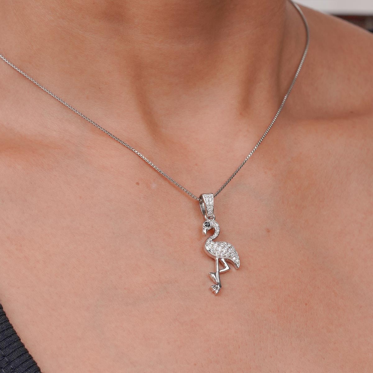 Moissanite flamingo pendant necklace on a girl's neck