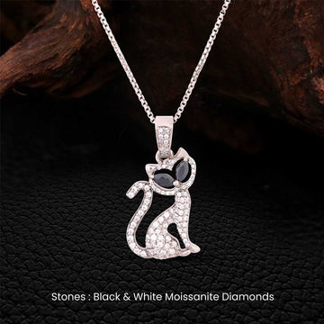 Cat pendant necklace with black and white moissanite diamonds on a dark background