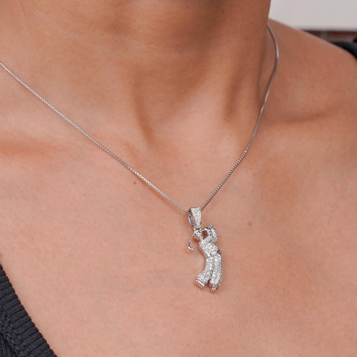 Golf Player pendant necklace on a person's neck