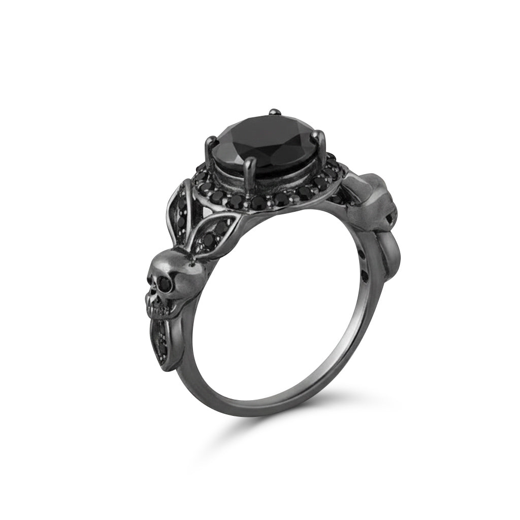 Black skull ring with floral leaf design and halo onyx gemstones set in gun metal finished sterling silver