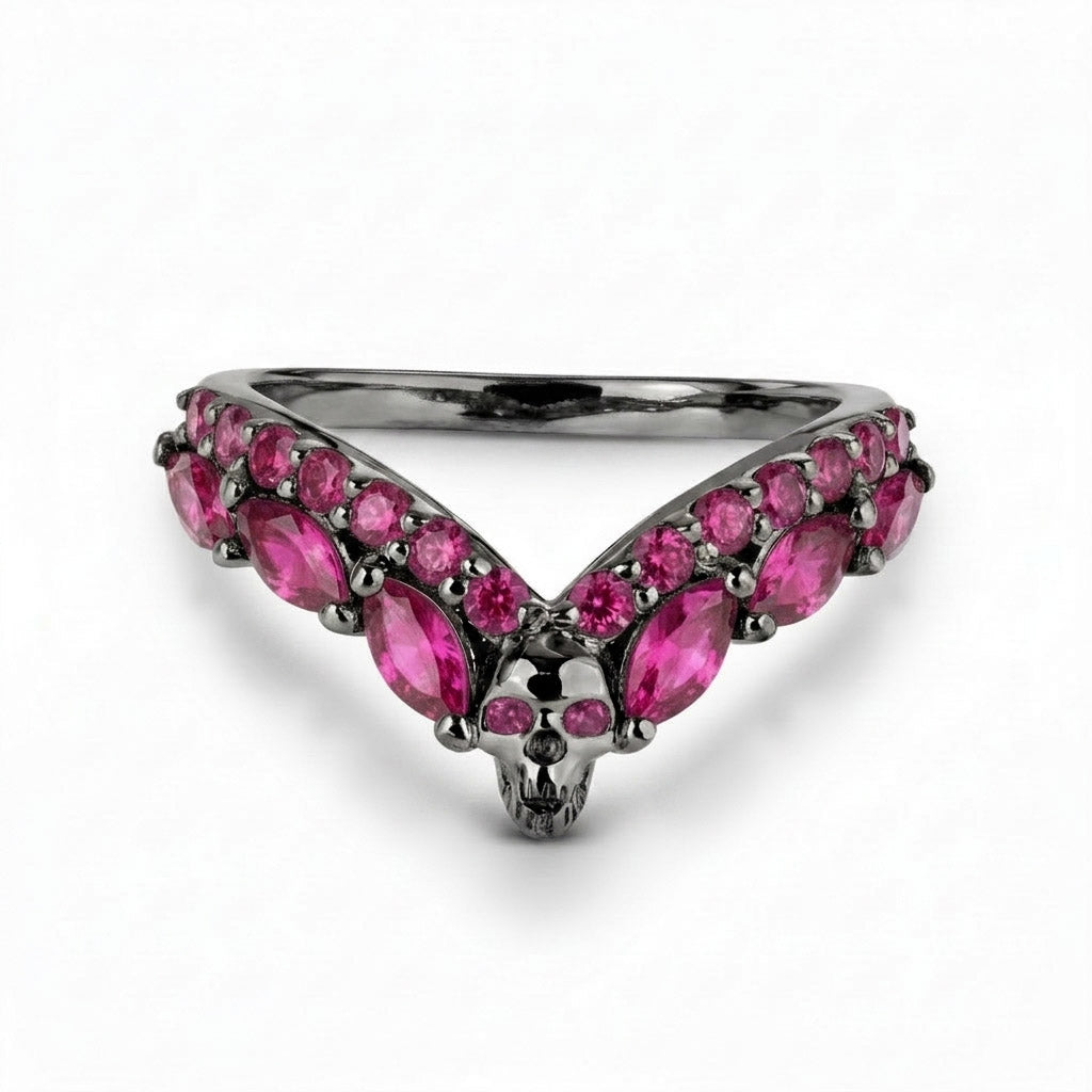 Romantic gothic wishbone ring guard featuring a skull design and striking pink ruby cubic zirconia accents