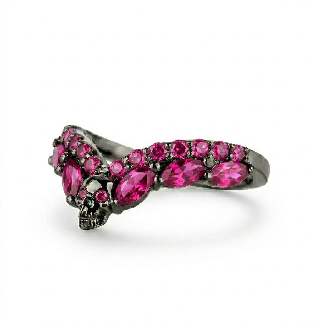 Romantic gothic wishbone ring guard featuring a skull design and striking pink ruby cubic zirconia accents