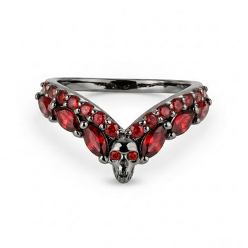 Macabre wishbone nesting skull ring in dark gunmetal finish on sterling silver and accented with vibrant red garnet cubic zirconia stones