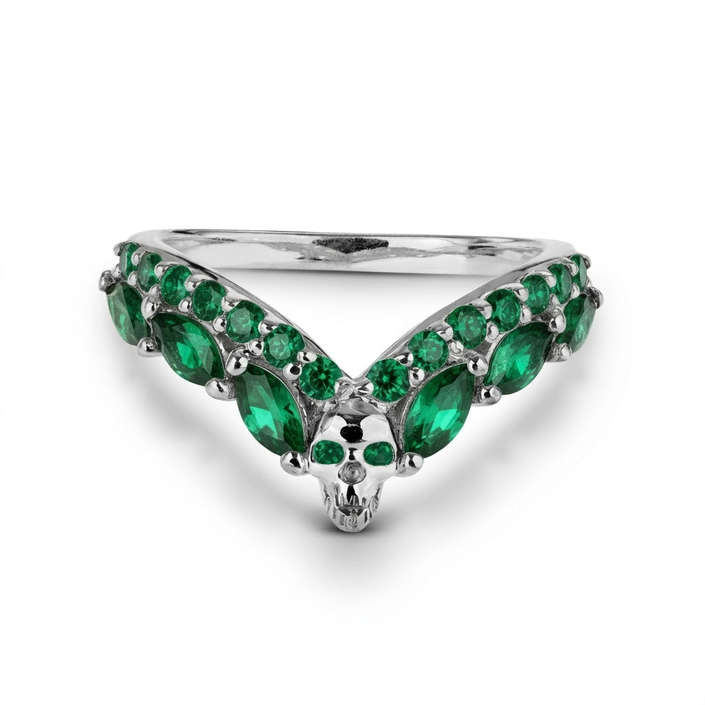 Unique V-shaped chevron skull ring enhancer in sterling silver with green emerald gemstone accents, an ideal gothic wedding band for alternative brides.