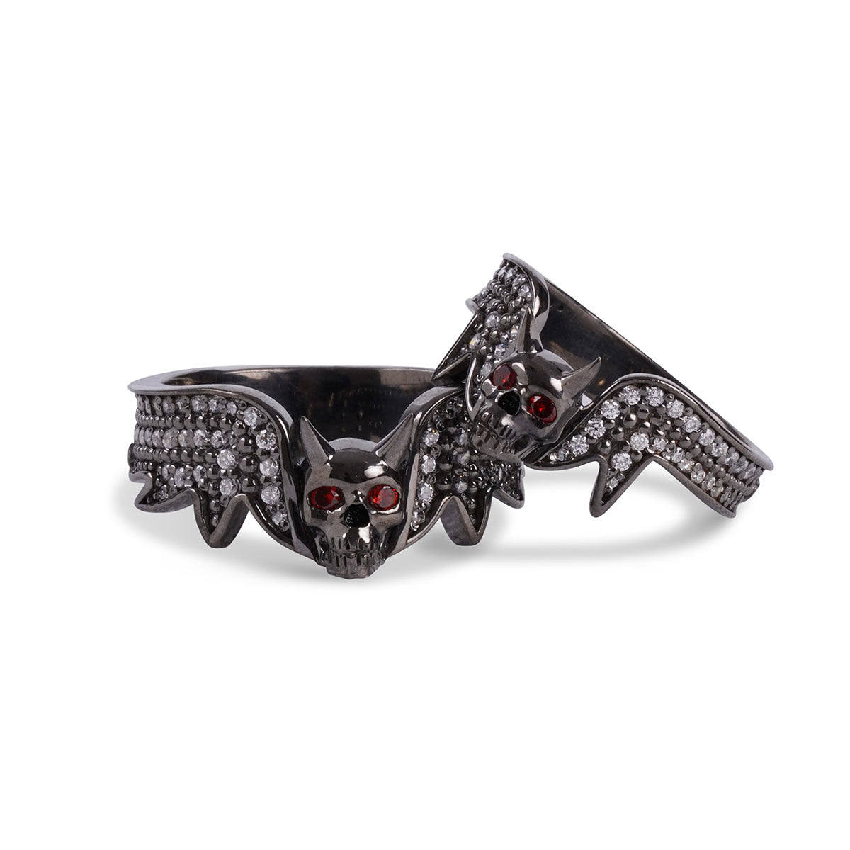 Matching devil skull couple wedding bands with red eyes and pavé-set diamonds in gun metal finished sterling silver