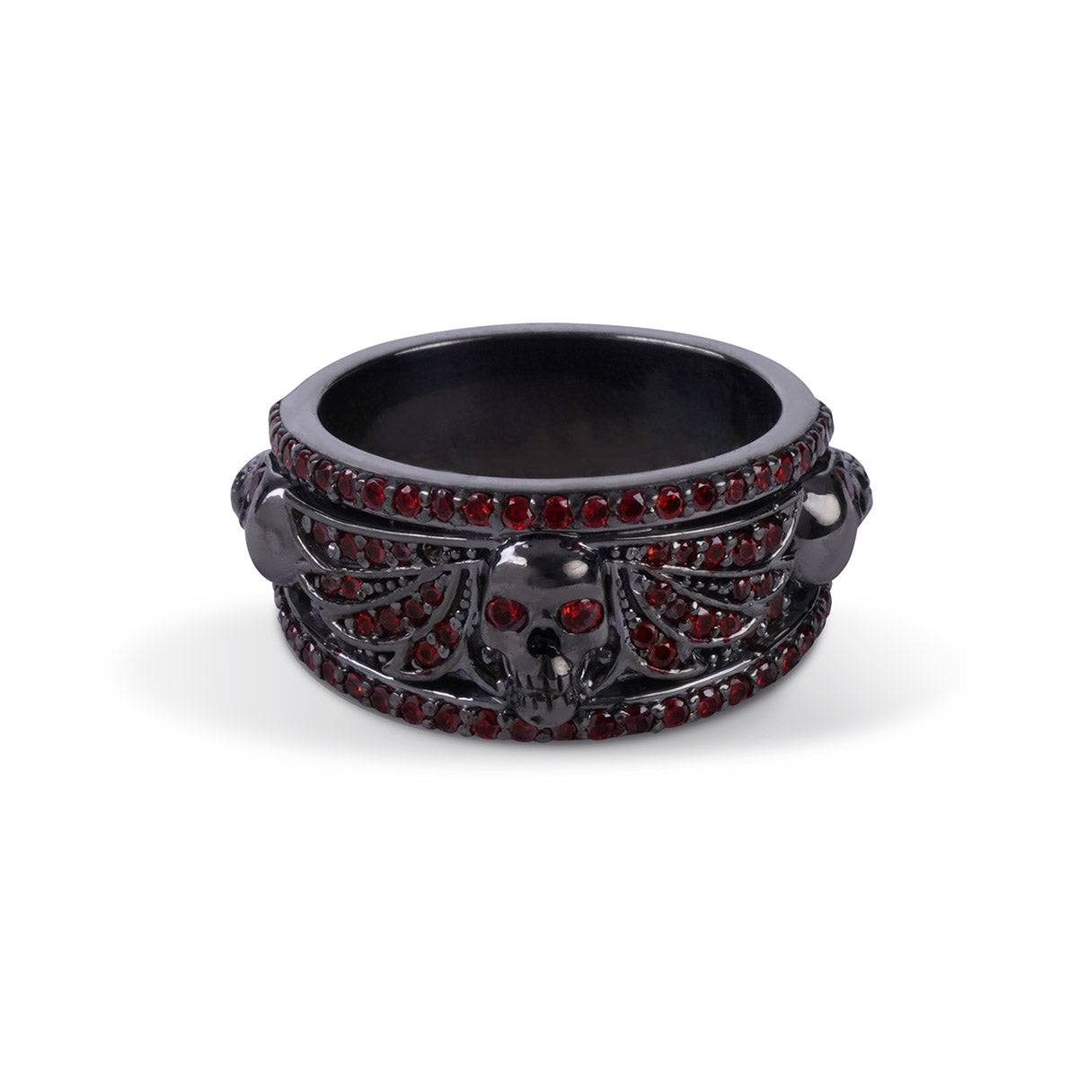 Black skull ring with spread angel wings design and red garnet gemstones set in gun metal finished sterling silver