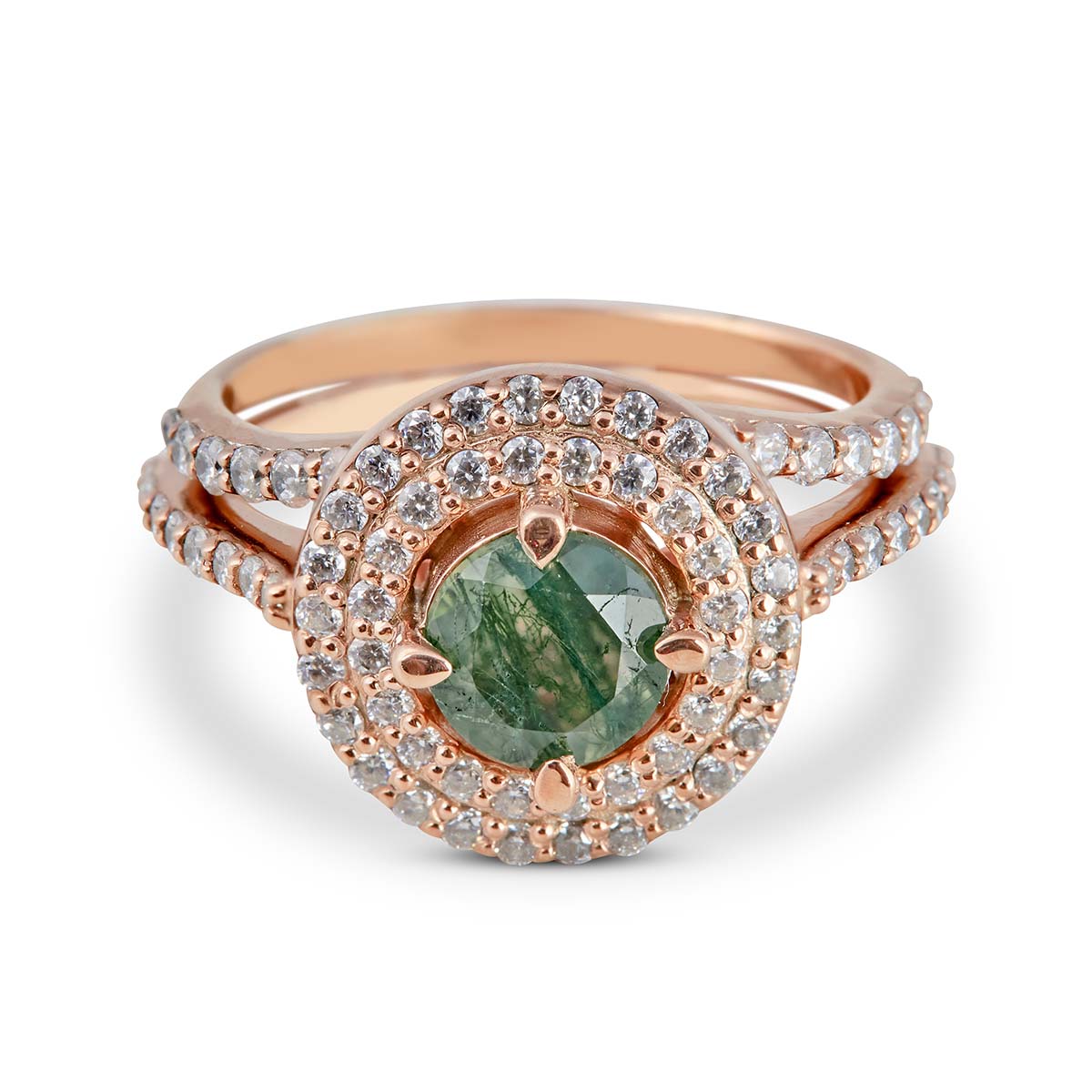 Engagement ring with a green gemstone and diamond accents on a white backgroud.