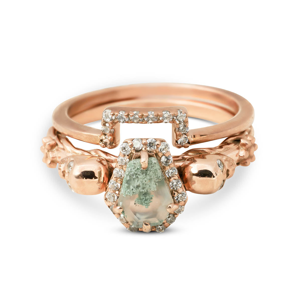 Coffin-cut moss agate ring in rose gold, featuring skull accents and a pave diamond halo.