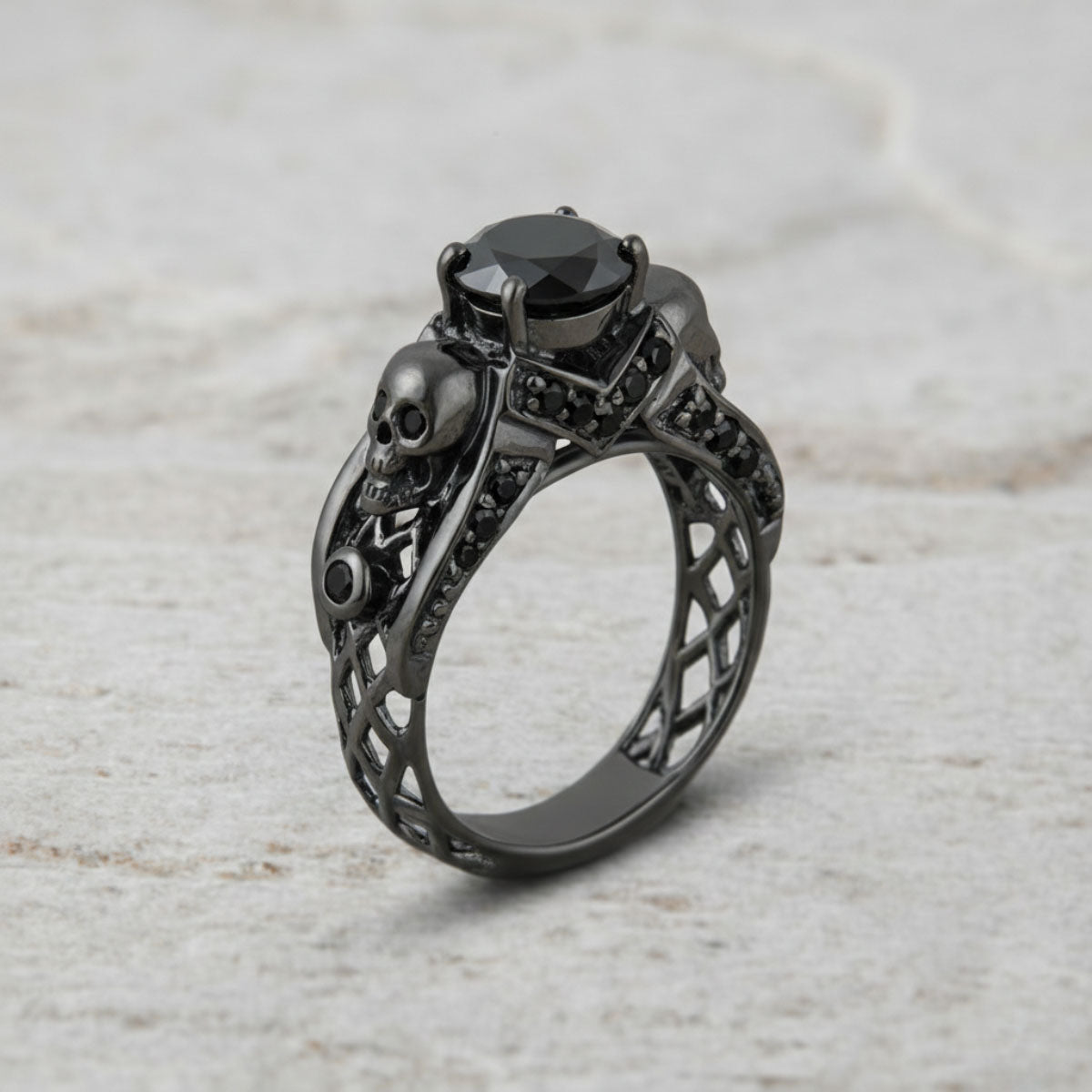 black skull ring with black onyx gemstones and criss cross mesh design band