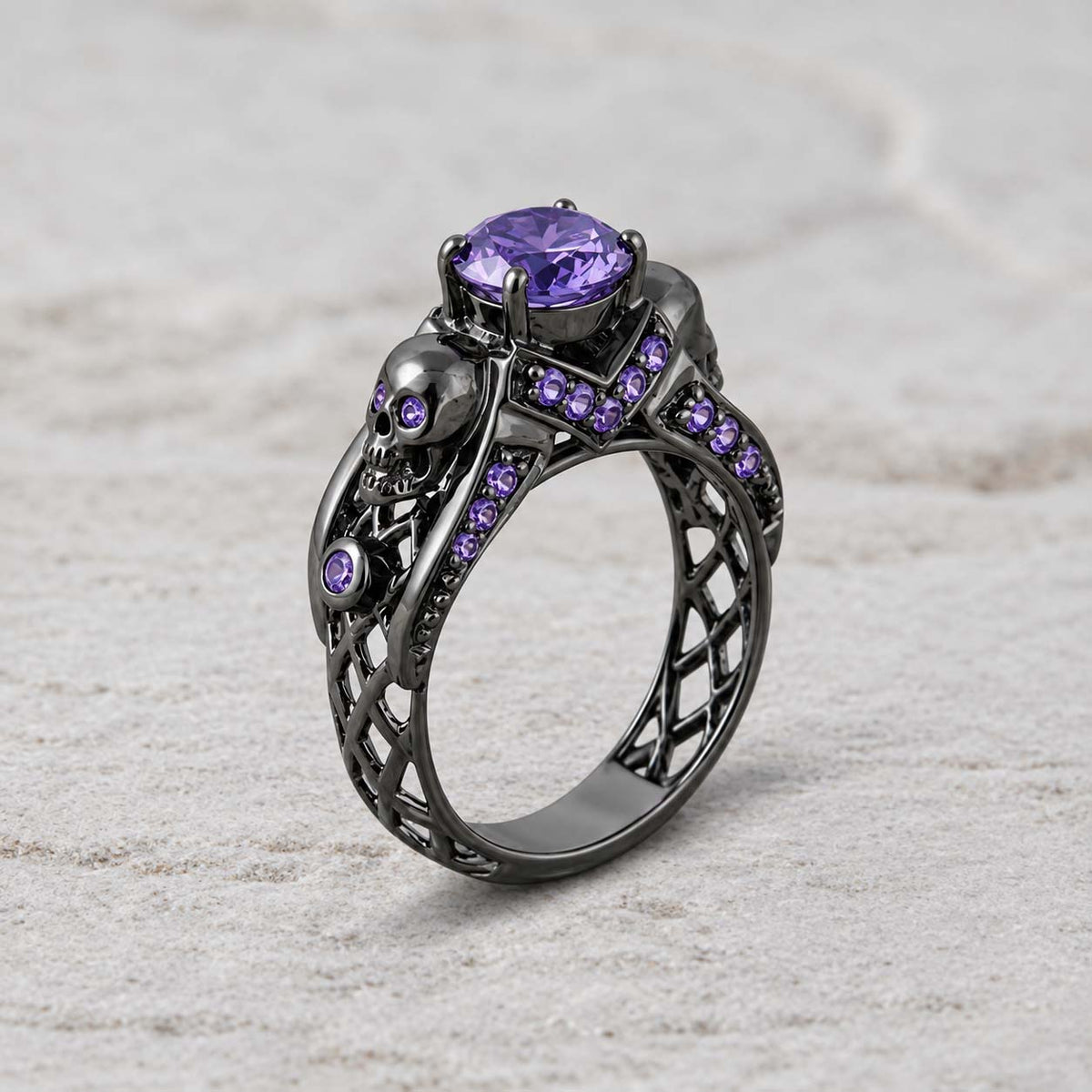Dark romance gothic engagement ring with skull details and sterling silver craftsmanship, accented with purple amethyst