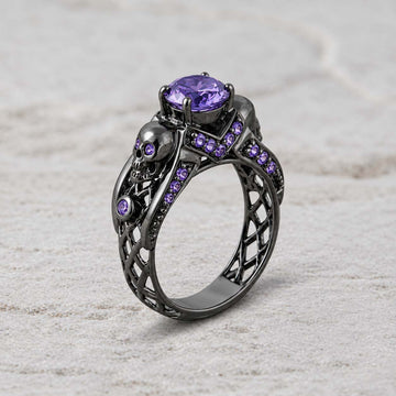Dark romance gothic engagement ring with skull details and sterling silver craftsmanship, accented with purple amethyst