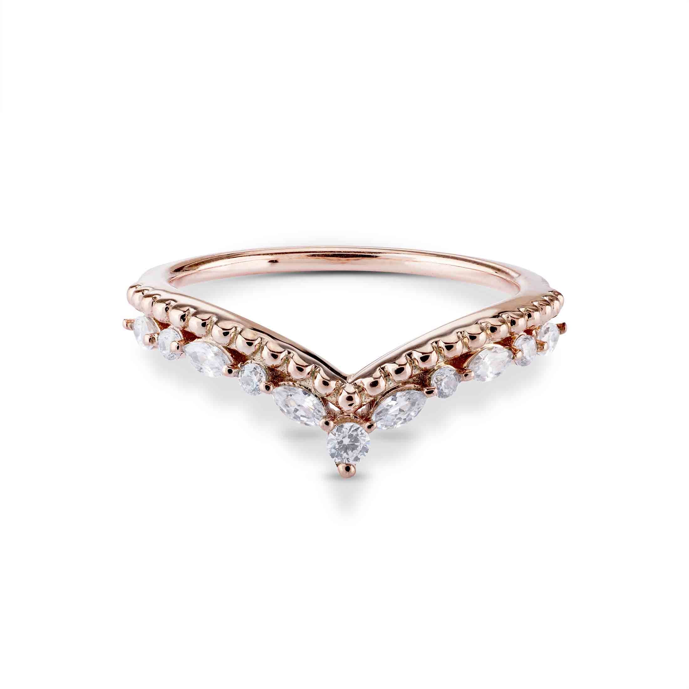 Rose gold ring with diamonds on a white background