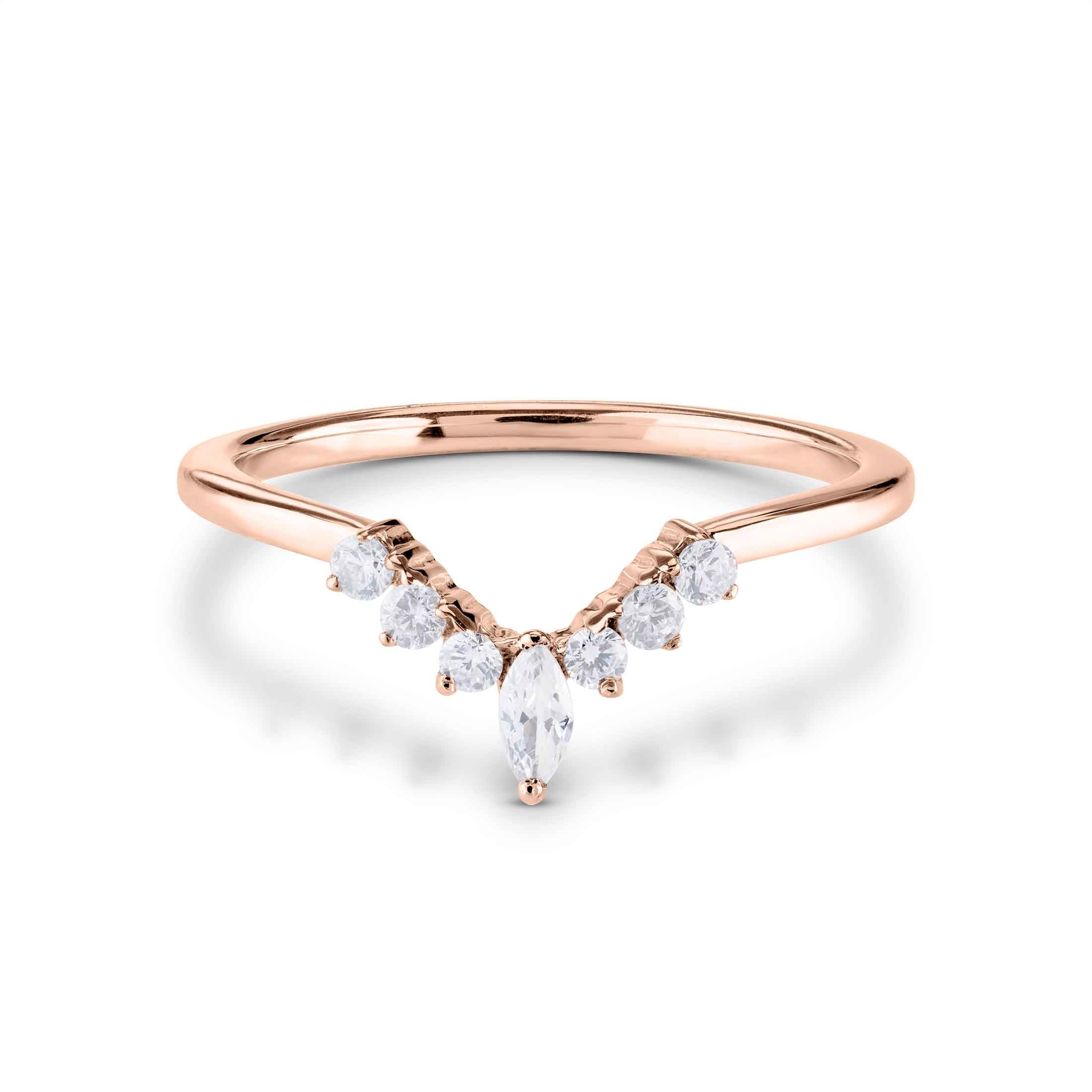 Rose gold ring with diamonds on a white background