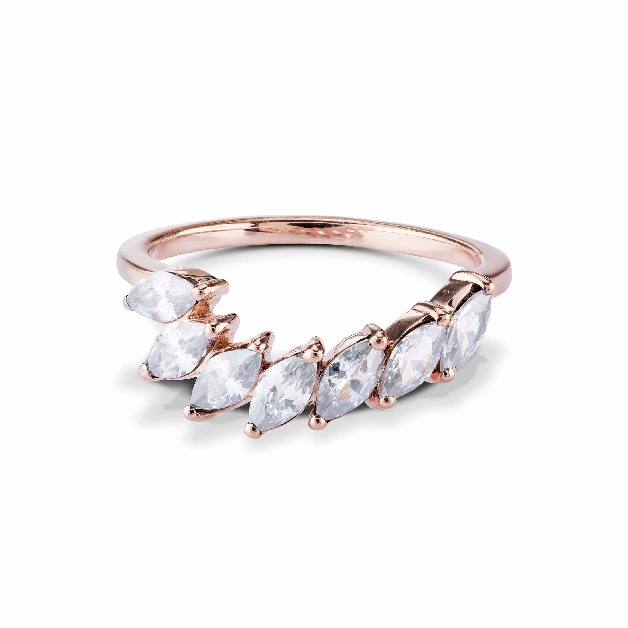 Rose gold curved band ring adorned with a row of pointed marquise-cut clear.