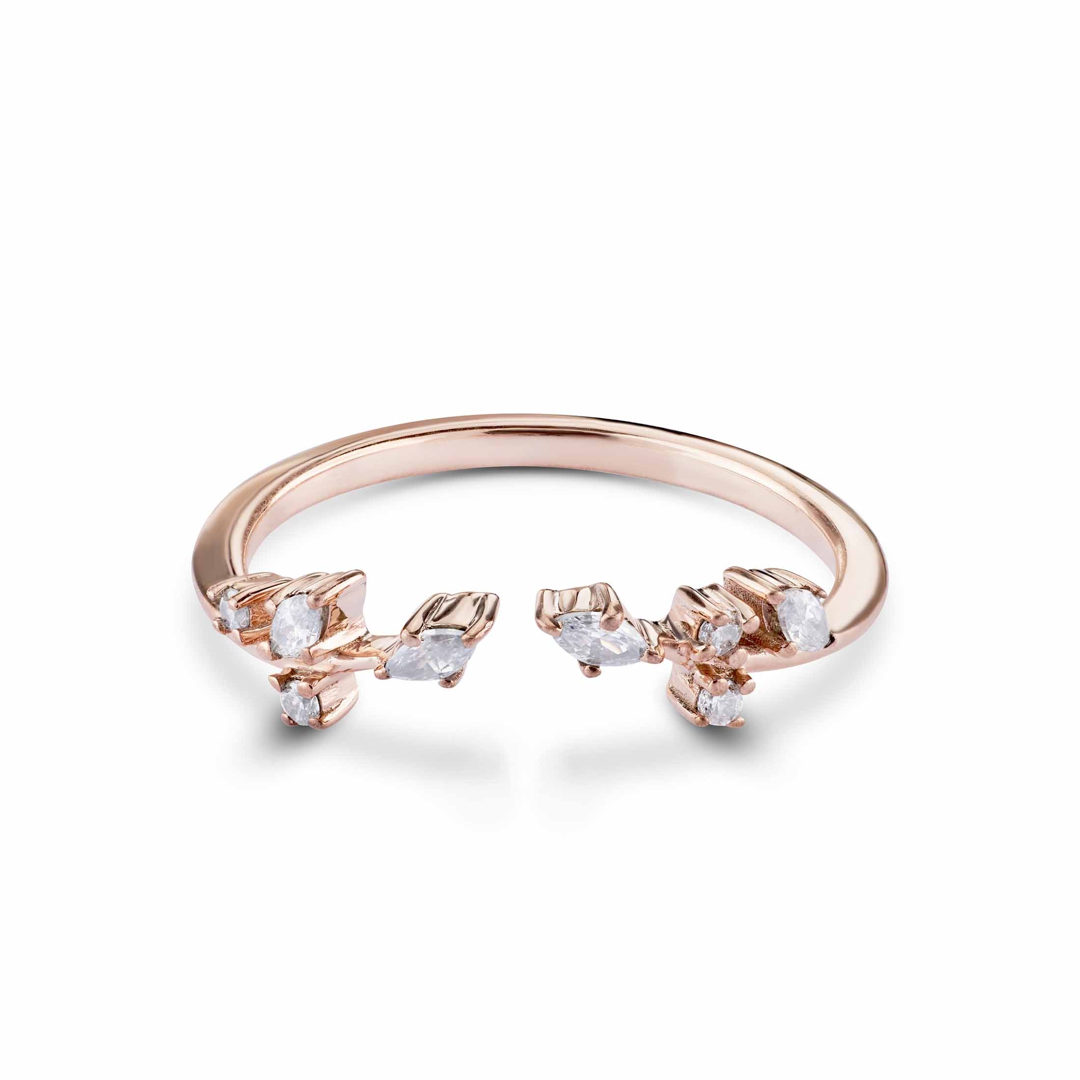 An adjustable-style rose gold ring with a delicate floral-inspired diamond vine design.