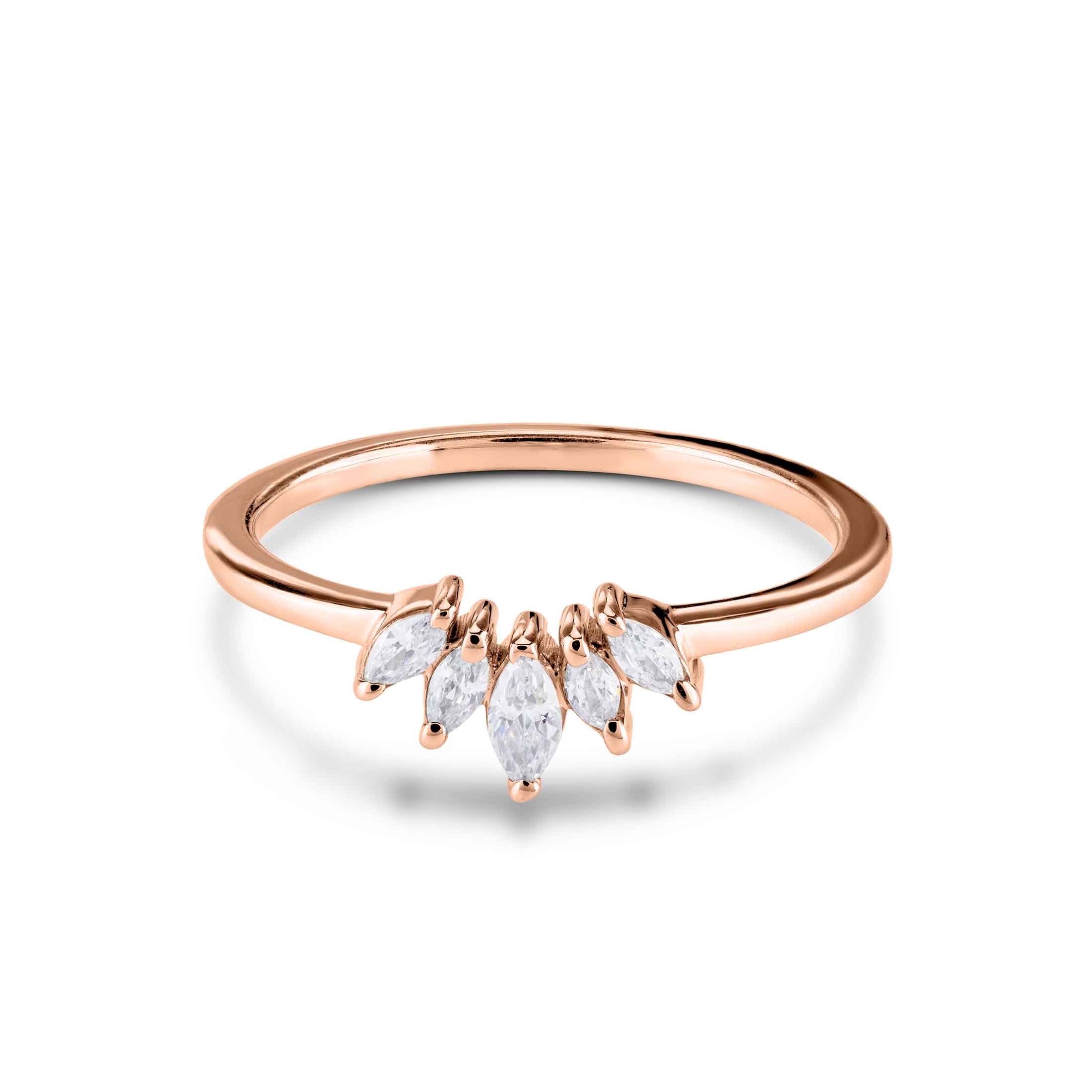 Rose gold ring with diamond-shaped stones on a white background