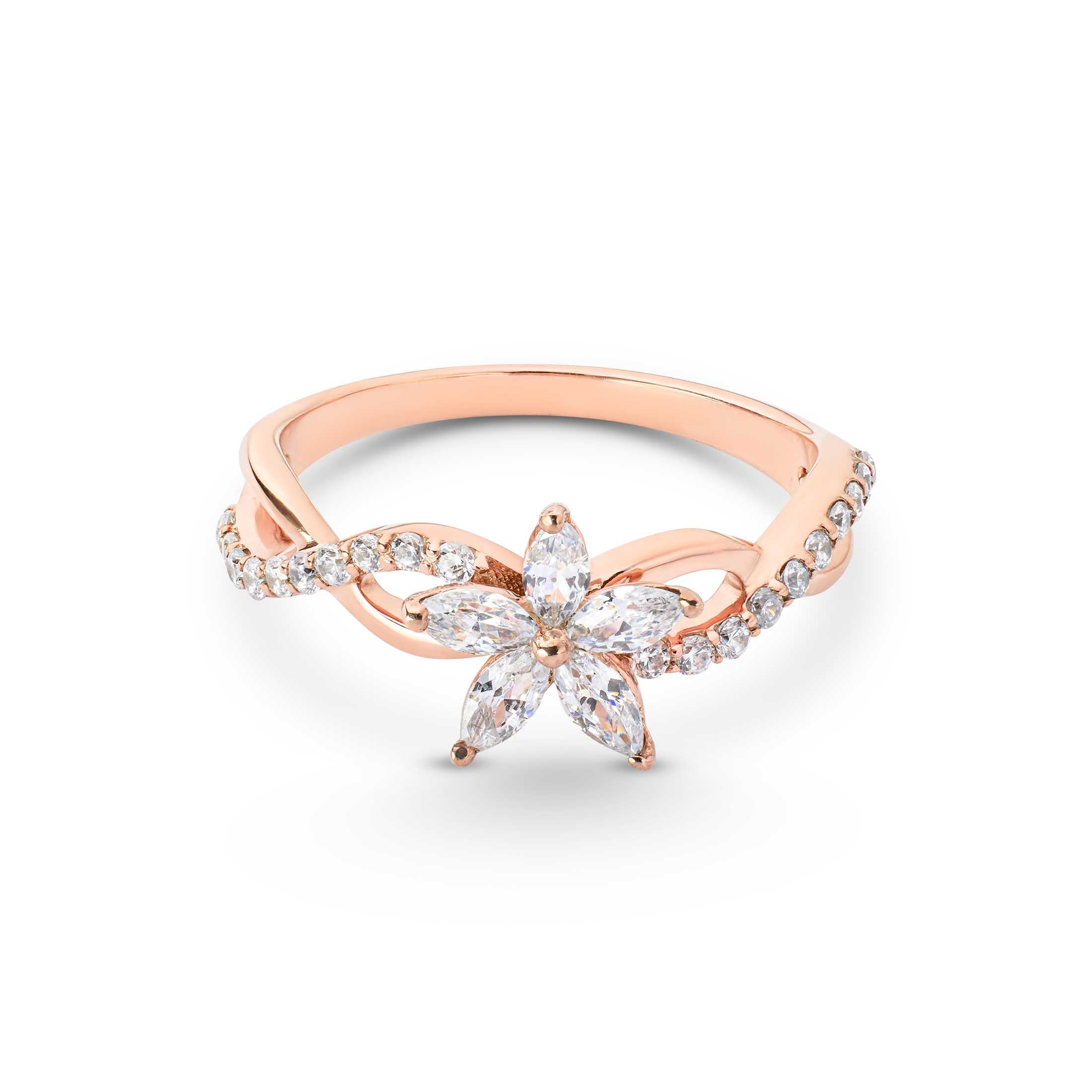 Rose gold ring with a star-shaped diamond on a white background