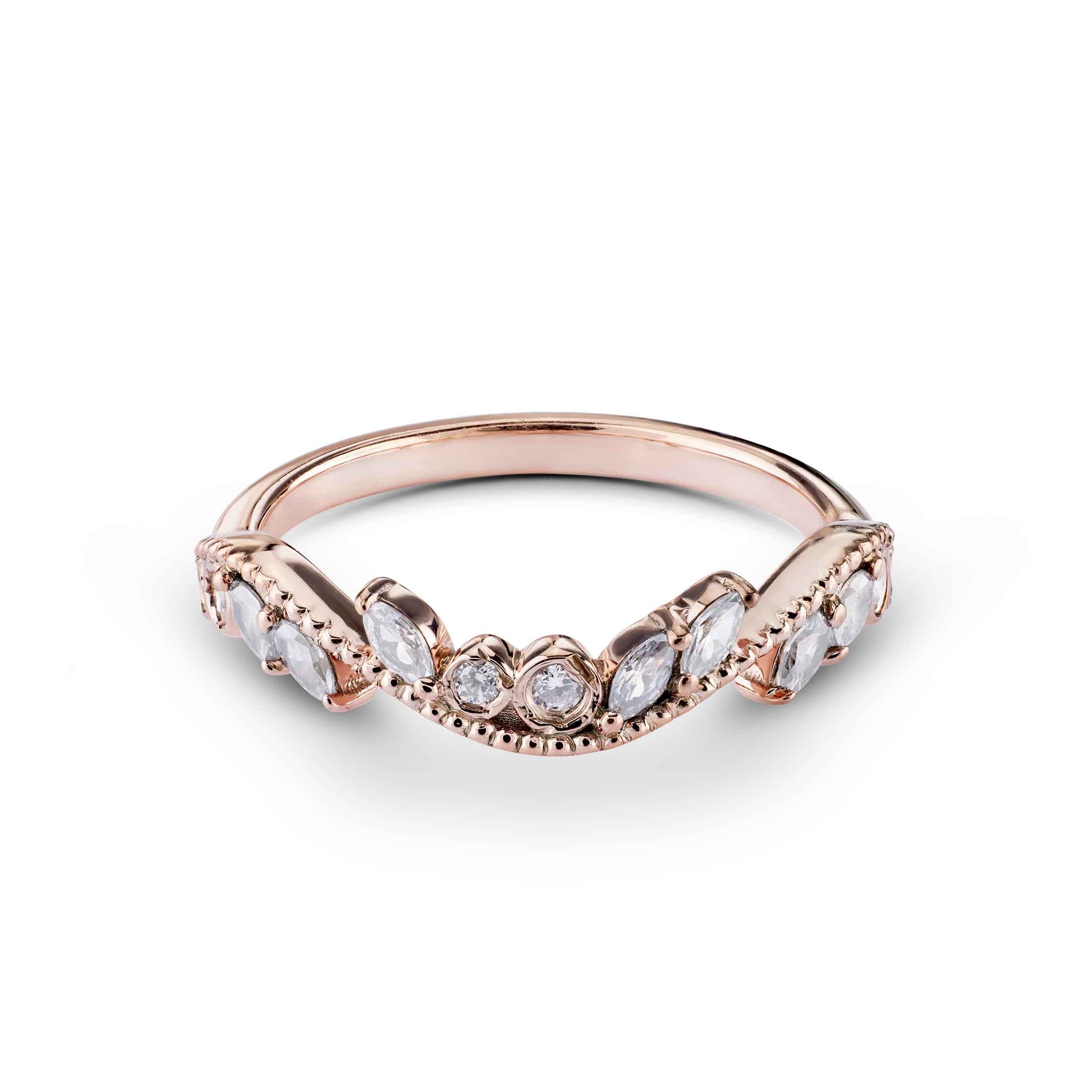 Delicate floral-inspired rose gold band with pear-shaped and round diamonds in a chevron arch.