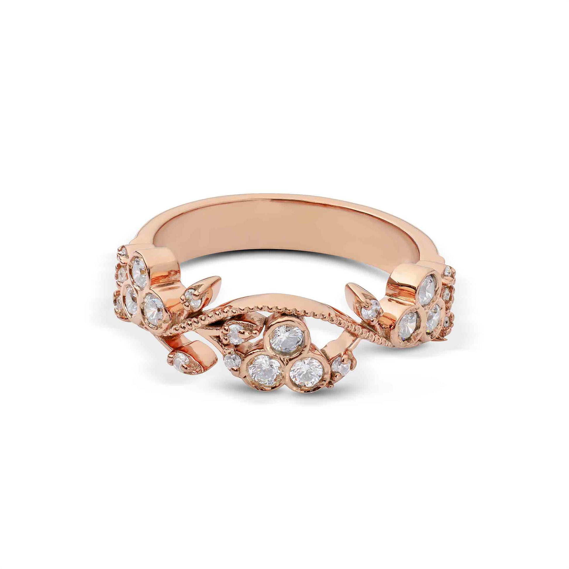 Rose gold ring with diamond accents on a white background
