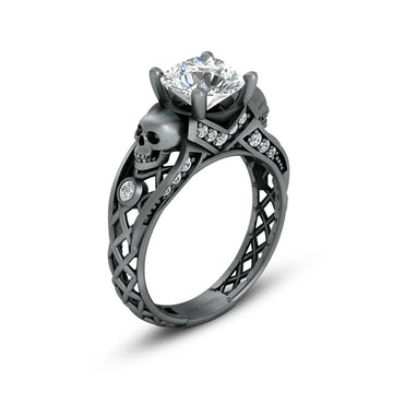 black skull ring with diamond and criss cross mesh design band