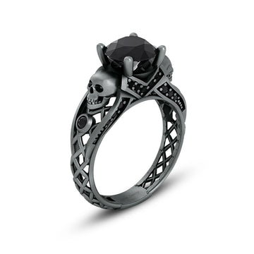 black skull ring with black onyx gemstones and criss cross mesh design band