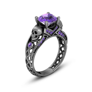 black skull ring with purple amethyst gemstones and criss cross mesh design band